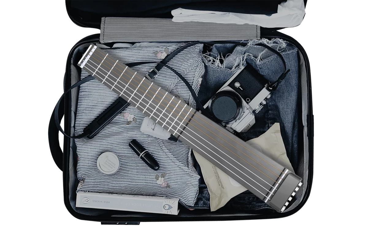 Suitcase-friendly travel guitar built to sound like acoustics